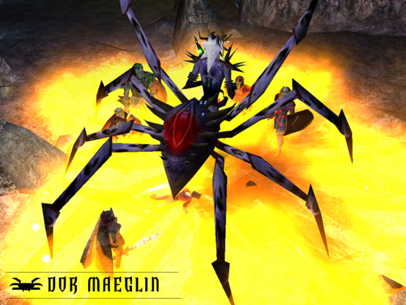 Players fighting a giant spider in a lava cavern